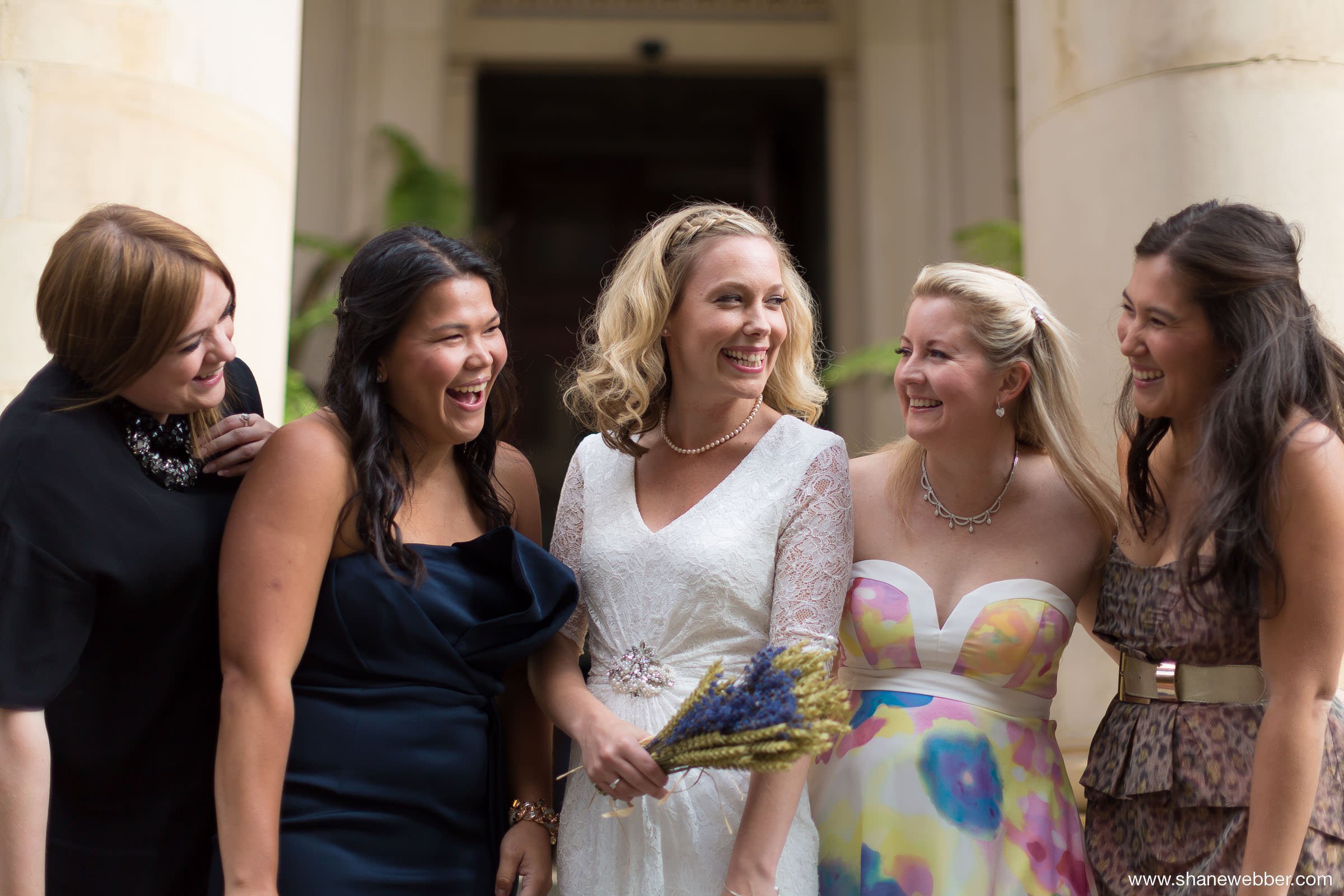 Bride and bridesmaids in non matching dresses