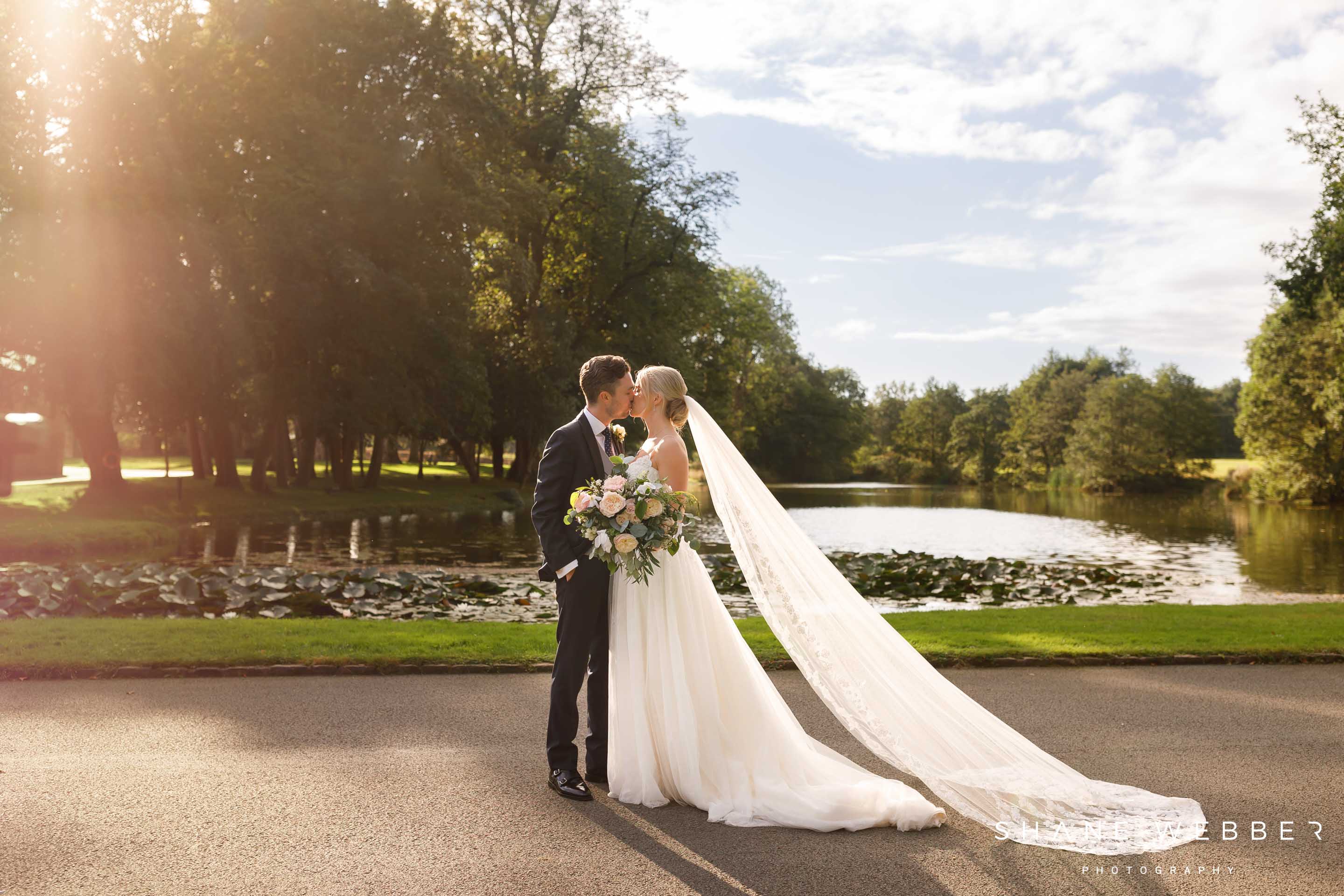 Wedding photos by the lake at Dorfold Hall