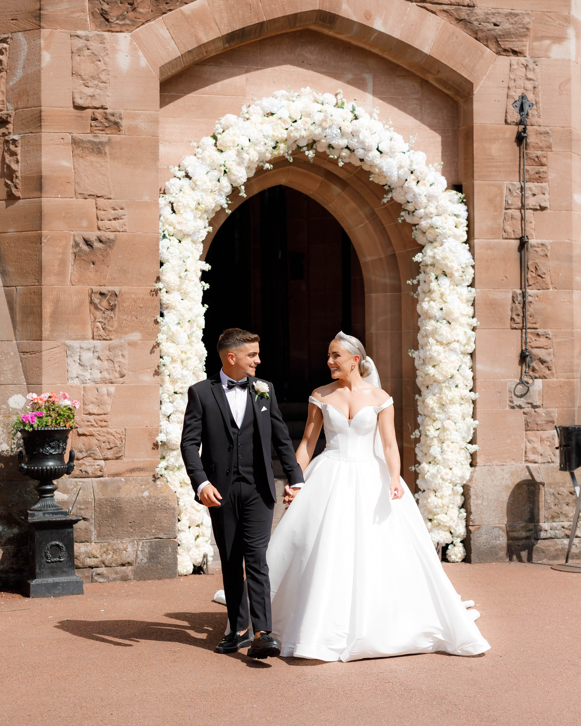 Peckforton Castle Wedding Photography in the grounds outside of Bride & Groom