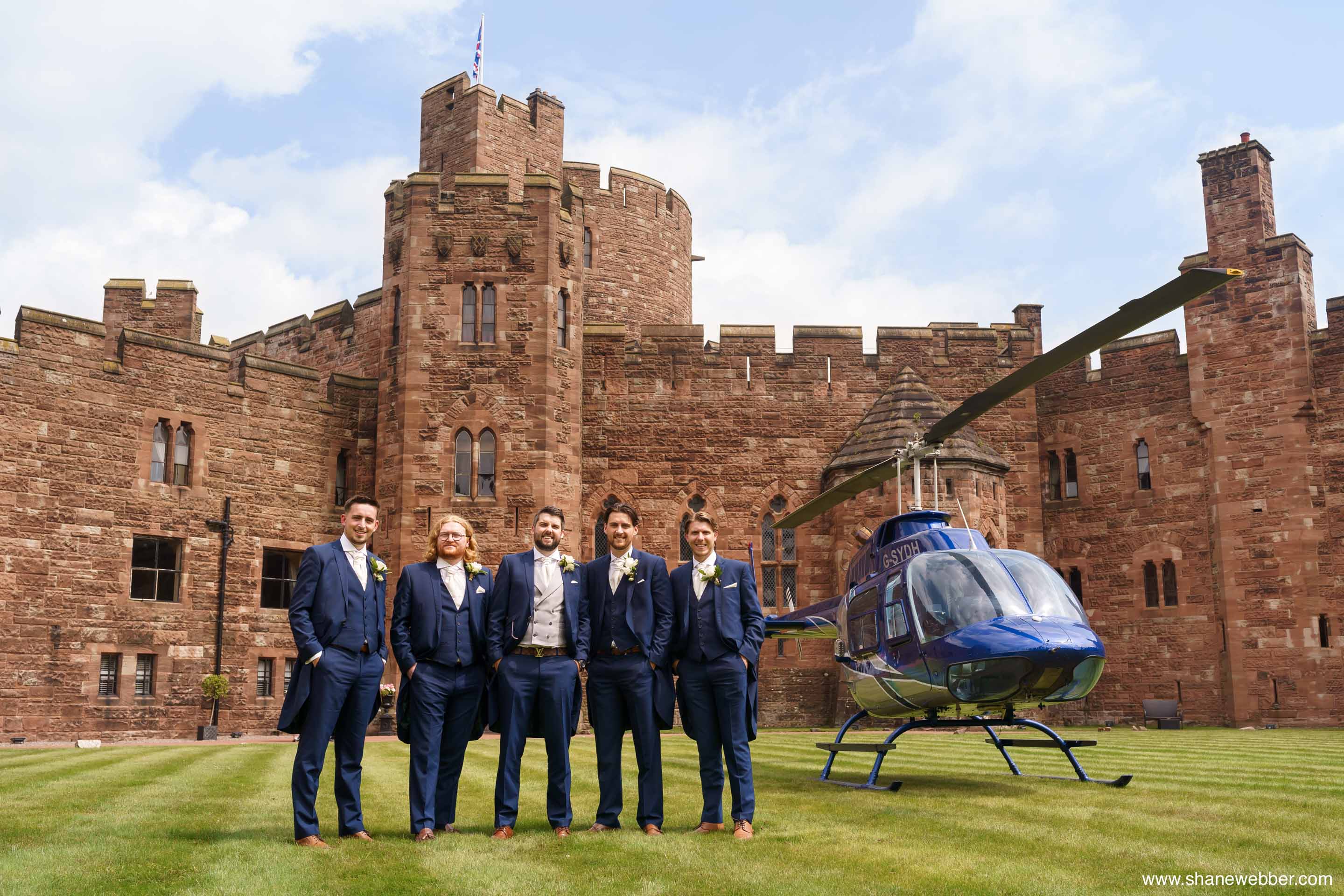 Groom arriving by helicopter at Peckforton Castle