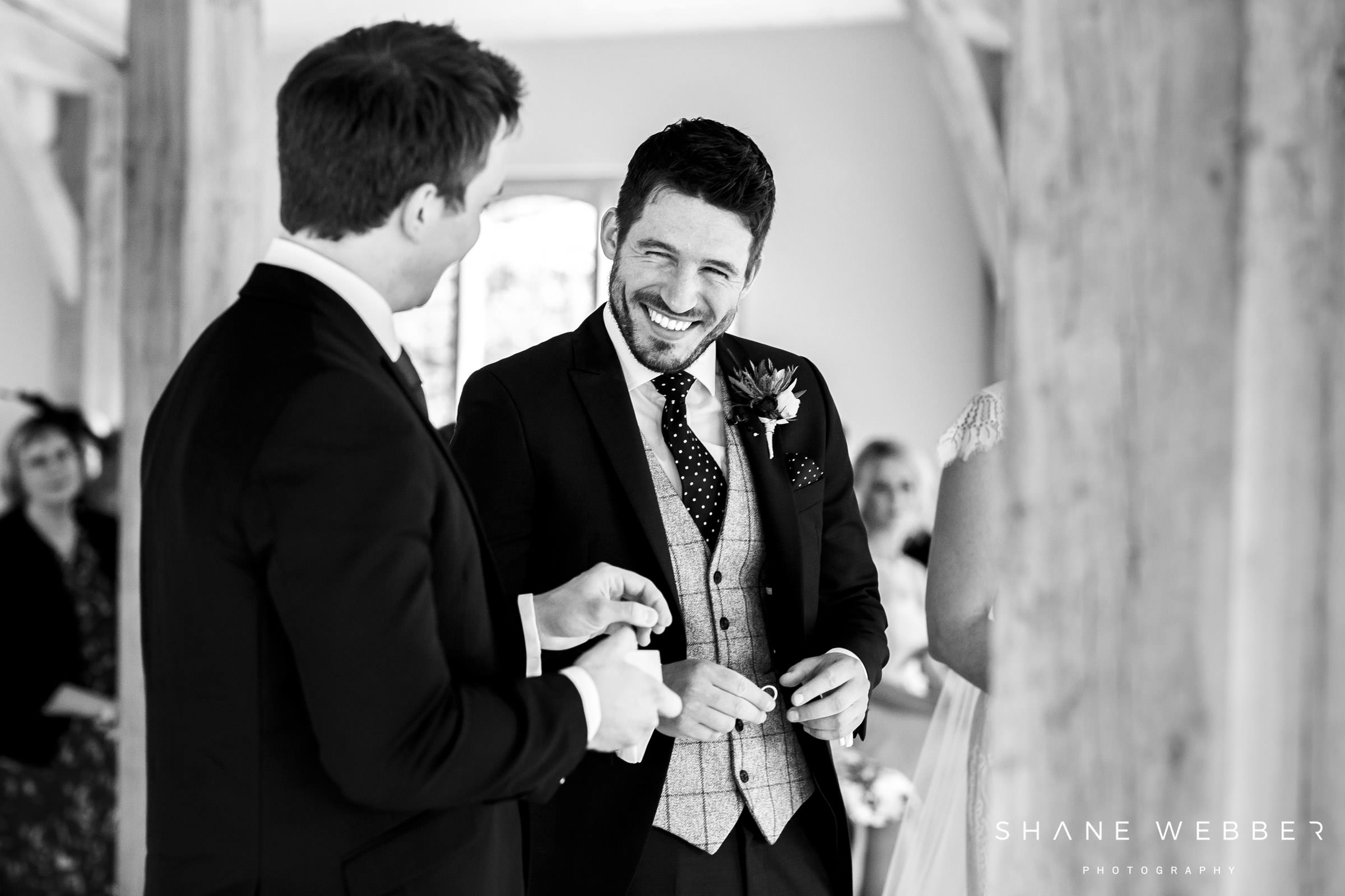 groom black and white documentary wedding photo